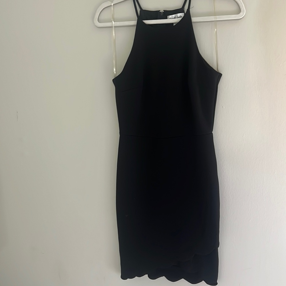 Black mini cocktail dress with scalloped hem